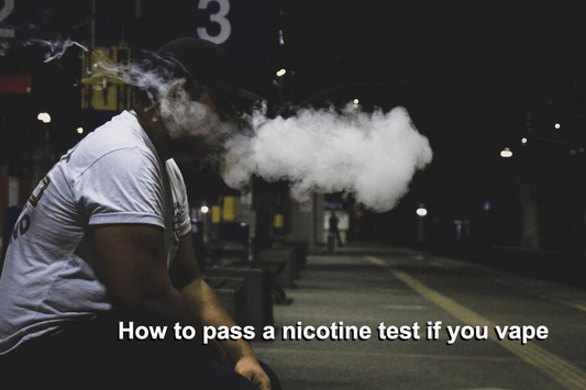 A person sitting in the train station and vaping with nicotine