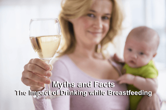 a woman holding a baby and a glass of a drink