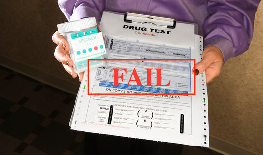 A Woman Holding a Failed Drug Test Result in Her Two Hands