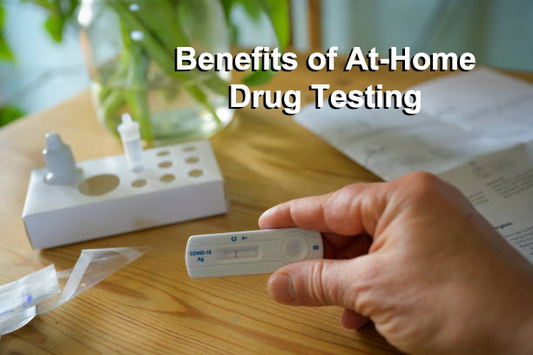 A hand on the table are holding the at-home drug test and looking for the result