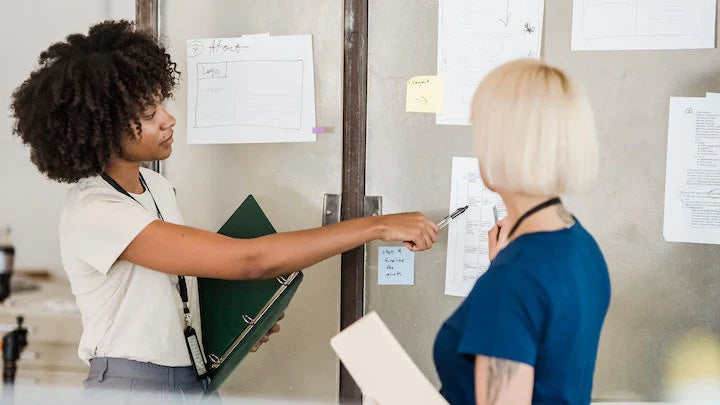 A medical examiner explaining to an employer the importance of a 7 panel drug test 