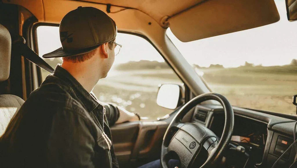 A professional truck driver driving on the open road 