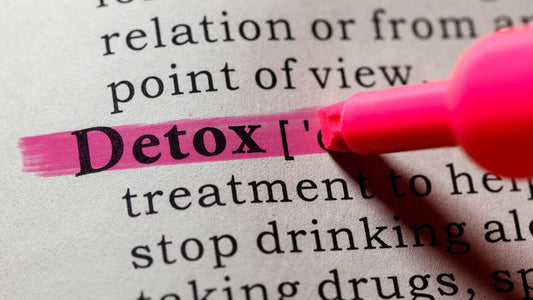 Word Detox in the Dictionary Marked with Red and its Definition Including Key Descriptive Words